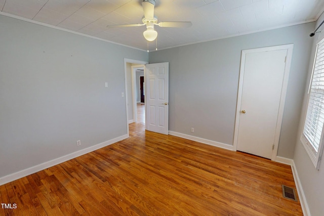 111 Dee Long Rd, Roxboro, NC 27574 - unfurnished bedroom with crown molding, wood finished floors, baseboards, and a ceiling fan