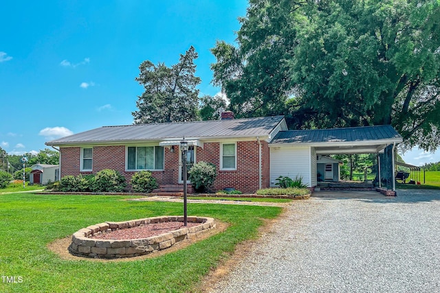 111 Dee Long Rd, Roxboro, NC 27574 - single story home featuring gravel driveway, a carport, a front lawn, brick siding, and metal roof