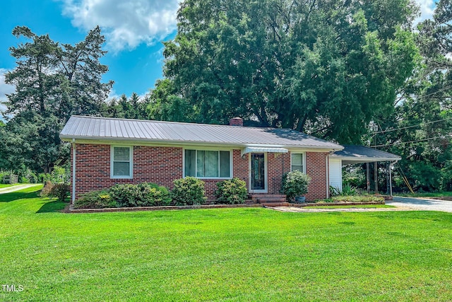 111 Dee Long Rd, Roxboro, NC 27574 - single story home featuring brick siding, a front yard, a chimney, metal roof, and driveway