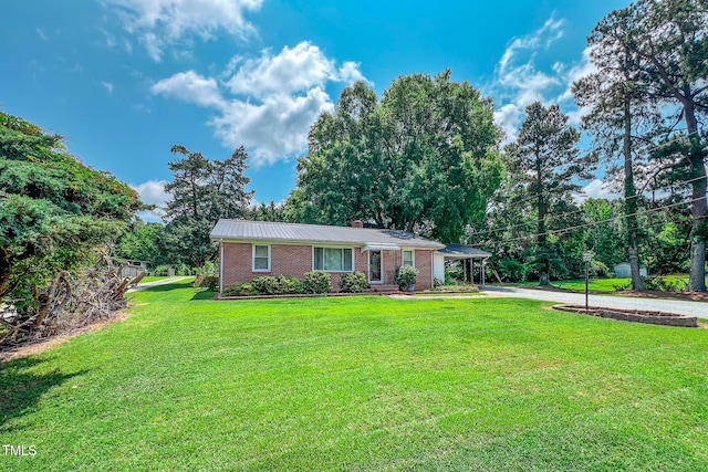 111 Dee Long Rd, Roxboro, NC 27574 - ranch-style house with driveway, a front yard, brick siding, and a chimney