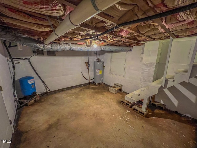 111 Dee Long Rd, Roxboro, NC 27574 - unfinished basement with a water pressure tank, electric water heater, and concrete block wall