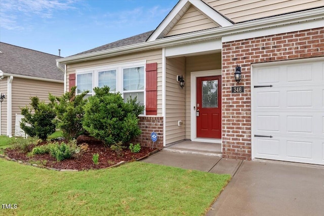 346 E Painted Way, Clayton, NC 27527 - entrance to property featuring brick siding, a lawn, and concrete driveway