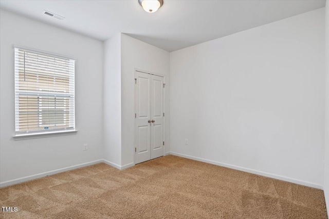 346 E Painted Way, Clayton, NC 27527 - unfurnished bedroom with light colored carpet and a closet