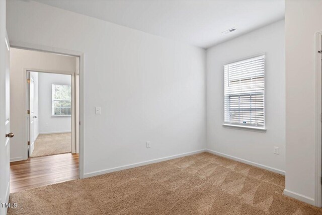 346 E Painted Way, Clayton, NC 27527 - carpeted empty room with baseboards