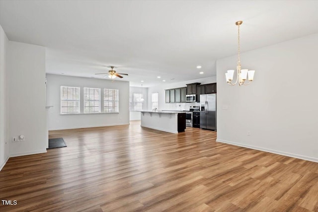 346 E Painted Way, Clayton, NC 27527 - unfurnished living room with a chandelier, ceiling fan, recessed lighting, and light wood-type flooring