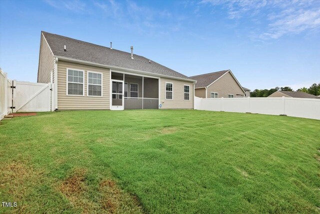 346 E Painted Way, Clayton, NC 27527 - back of property featuring a fenced backyard, a gate, and a sunroom