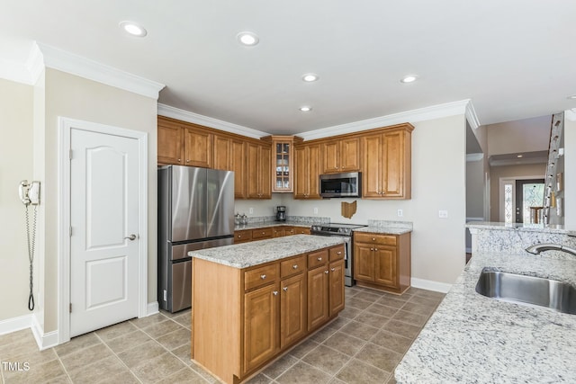 30155 Pharr, Chapel Hill, NC 27517 - kitchen featuring appliances with stainless steel finishes, a sink, baseboards, crown molding, and brown cabinets