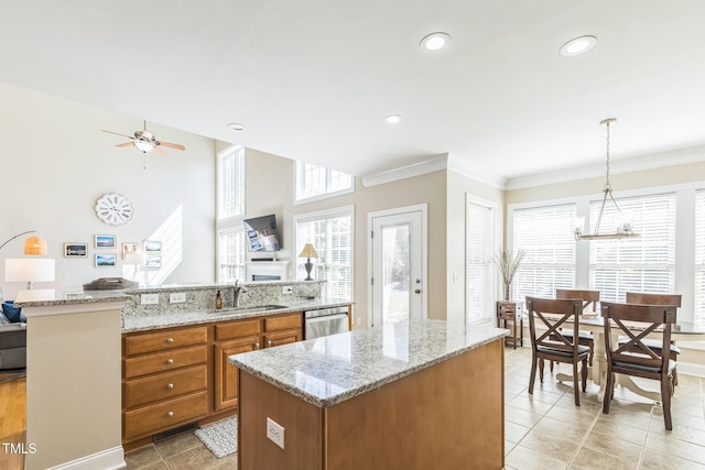 30155 Pharr, Chapel Hill, NC 27517 - kitchen featuring a kitchen island, a sink, brown cabinets, ceiling fan, and stainless steel dishwasher