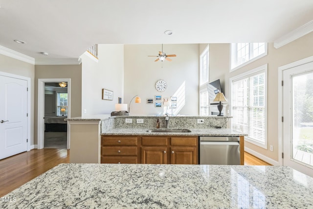 30155 Pharr, Chapel Hill, NC 27517 - kitchen featuring stainless steel dishwasher, a sink, a ceiling fan, wood finished floors, and ornamental molding
