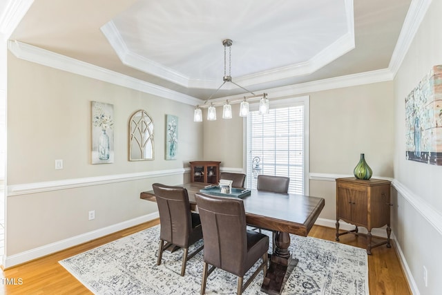 30155 Pharr, Chapel Hill, NC 27517 - dining space with wood finished floors, a tray ceiling, and ornamental molding