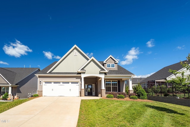 1085 Lobdale Ct, Burlington, NC 27215 - craftsman inspired home with driveway, an attached garage, board and batten siding, and brick siding