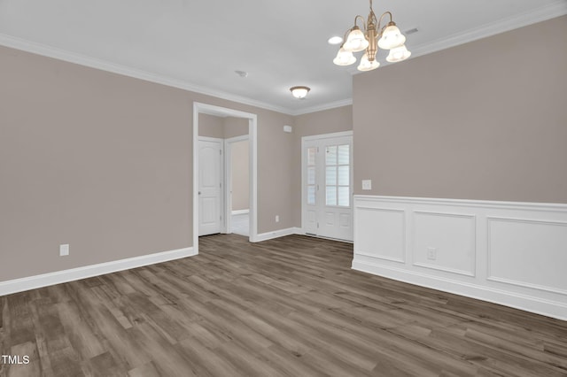 1085 Lobdale Ct, Burlington, NC 27215 - empty room with a chandelier, ornamental molding, wood finished floors, baseboards, and wainscoting