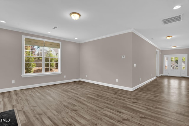 1085 Lobdale Ct, Burlington, NC 27215 - unfurnished living room with crown molding, wood finished floors, baseboards, and recessed lighting