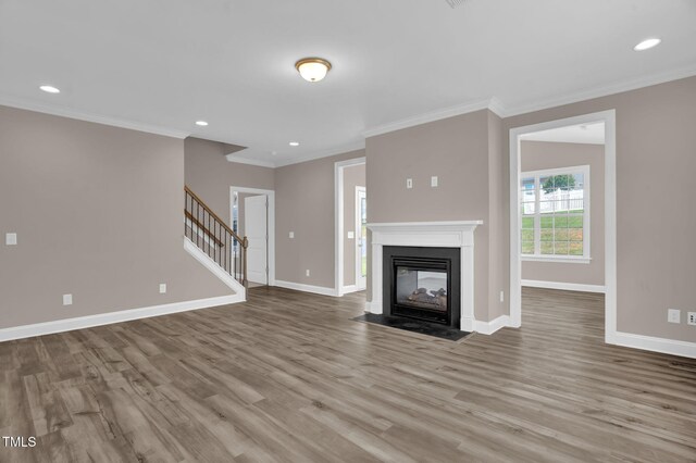1085 Lobdale Ct, Burlington, NC 27215 - unfurnished living room with baseboards, wood finished floors, ornamental molding, recessed lighting, and stairs