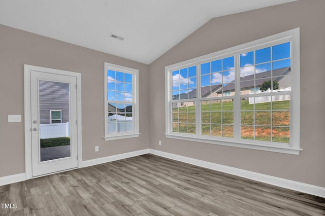 1085 Lobdale Ct, Burlington, NC 27215 - empty room featuring wood finished floors, lofted ceiling, and baseboards