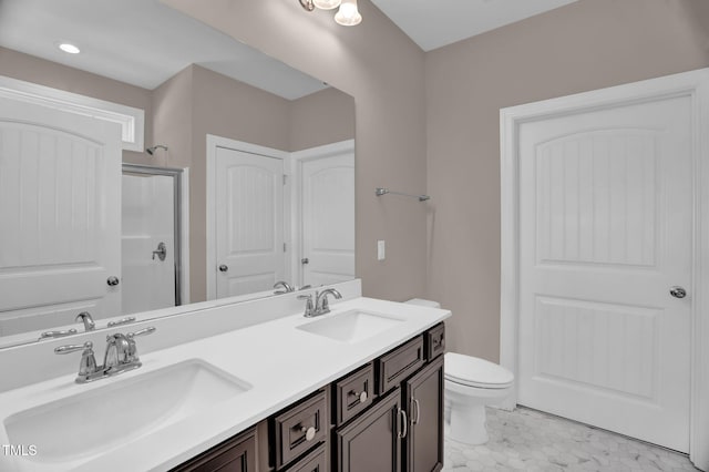 1085 Lobdale Ct, Burlington, NC 27215 - full bathroom featuring double vanity, a shower with door, and toilet