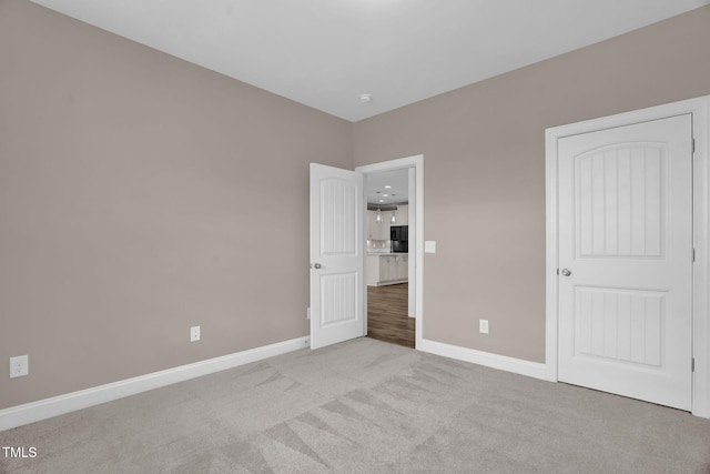 1085 Lobdale Ct, Burlington, NC 27215 - unfurnished bedroom featuring carpet flooring and baseboards