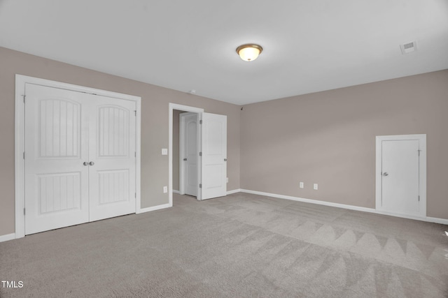 1085 Lobdale Ct, Burlington, NC 27215 - unfurnished bedroom with carpet floors, baseboards, and a closet
