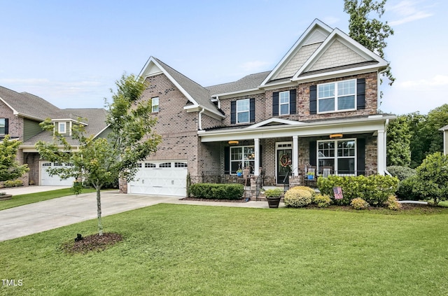 2100 Della Ct, Apex, NC 27502 - craftsman-style house with a porch, driveway, a front lawn, and stone siding