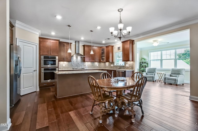 2100 Della Ct, Apex, NC 27502 - dining area featuring crown molding, a chandelier, dark wood-style flooring, recessed lighting, and ceiling fan