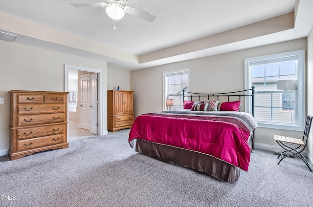 2100 Della Ct, Apex, NC 27502 - bedroom featuring carpet flooring, baseboards, ensuite bathroom, and ceiling fan