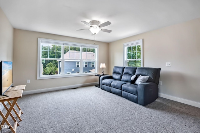 2100 Della Ct, Apex, NC 27502 - living area with carpet flooring, a ceiling fan, and baseboards