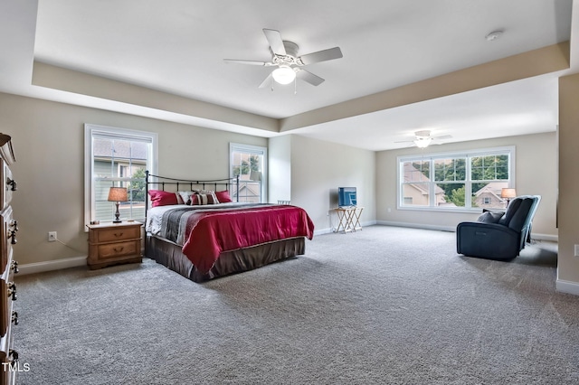 2100 Della Ct, Apex, NC 27502 - bedroom with carpet floors, baseboards, and a ceiling fan