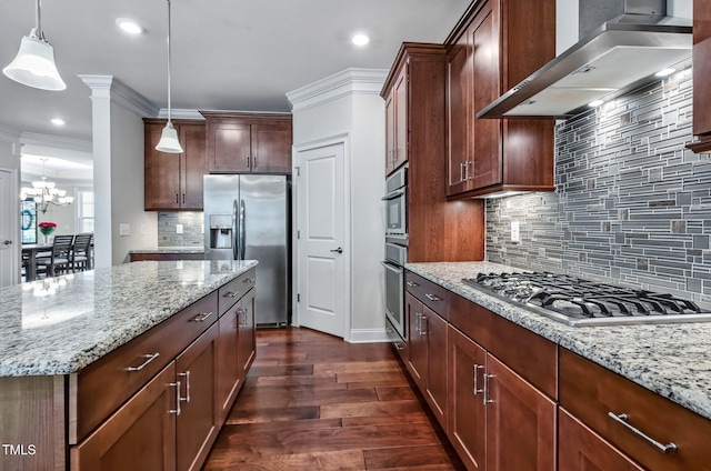 2100 Della Ct, Apex, NC 27502 - kitchen with appliances with stainless steel finishes, wall chimney exhaust hood, light stone countertops, dark wood-style floors, and a chandelier