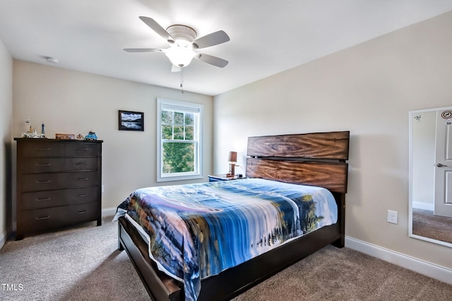 2100 Della Ct, Apex, NC 27502 - bedroom with carpet flooring, baseboards, and ceiling fan