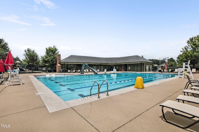 2100 Della Ct, Apex, NC 27502 - community pool featuring a water slide and a patio