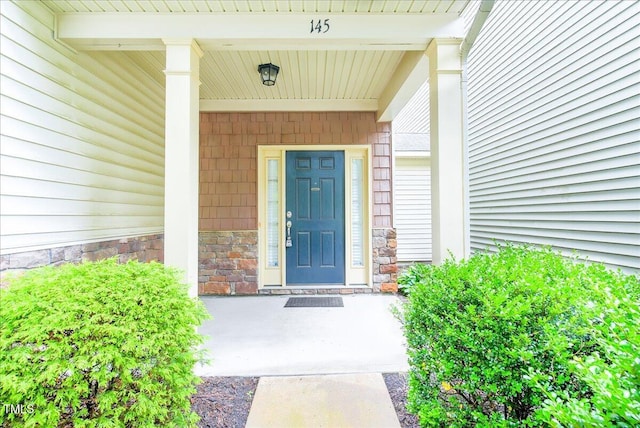 145 Torrey Heights Ln, Durham, NC 27703 - entrance to property featuring stone siding and a porch
