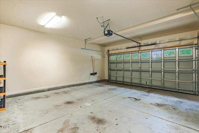 145 Torrey Heights Ln, Durham, NC 27703 - garage featuring a garage door opener and baseboards