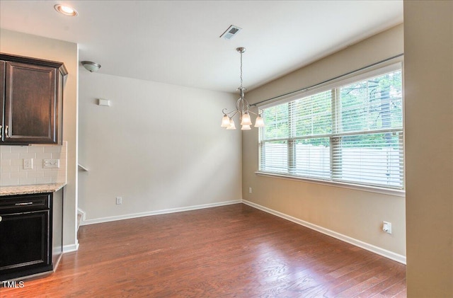 145 Torrey Heights Ln, Durham, NC 27703 - unfurnished dining area featuring a chandelier, wood finished floors, baseboards, and recessed lighting