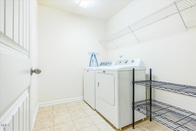 145 Torrey Heights Ln, Durham, NC 27703 - laundry room with washing machine and clothes dryer and baseboards
