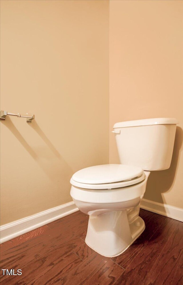 145 Torrey Heights Ln, Durham, NC 27703 - half bath featuring baseboards, toilet, and wood finished floors
