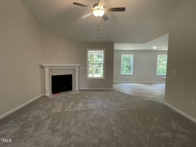 226 Bonsai Way, Four Oaks, NC 27524 - unfurnished living room with ceiling fan, carpet flooring, and a high end fireplace