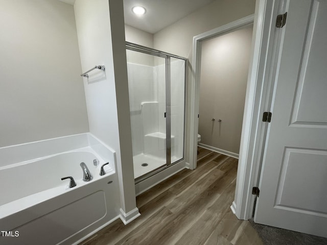 226 Bonsai Way, Four Oaks, NC 27524 - full bathroom with a stall shower, a garden tub, and wood finished floors