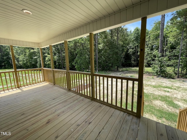 226 Bonsai Way, Four Oaks, NC 27524 - wooden deck featuring view of scattered trees