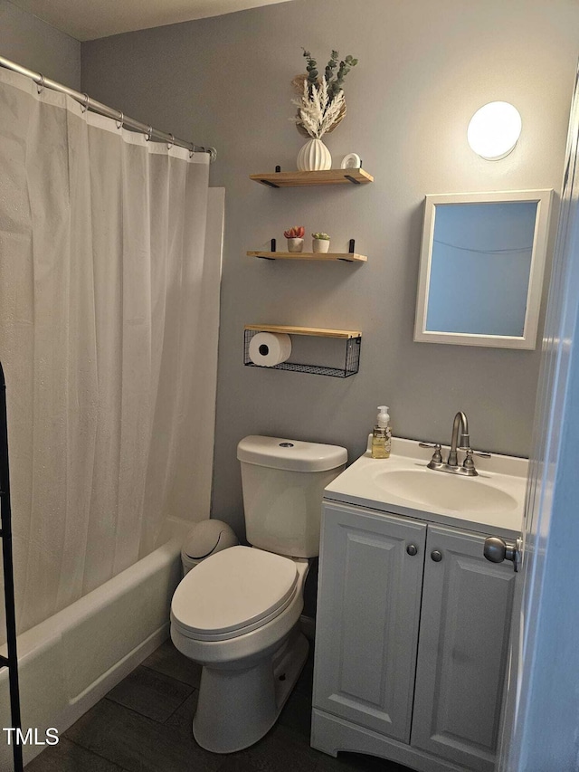 118 Lynn Rd, Durham, NC 27703 - bathroom featuring vanity, toilet, and shower / tub combo with curtain