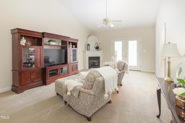 128 Olde Manor Ct, Siler City, NC 27344 - living room featuring light carpet, ceiling fan, lofted ceiling, baseboards, and a fireplace