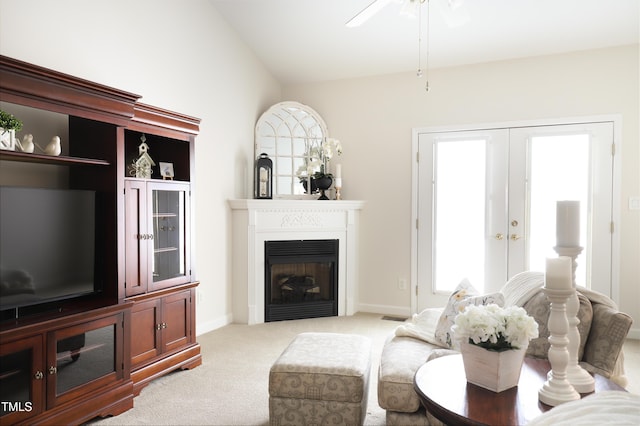 128 Olde Manor Ct, Siler City, NC 27344 - carpeted living room featuring a ceiling fan, a fireplace, healthy amount of natural light, french doors, and lofted ceiling
