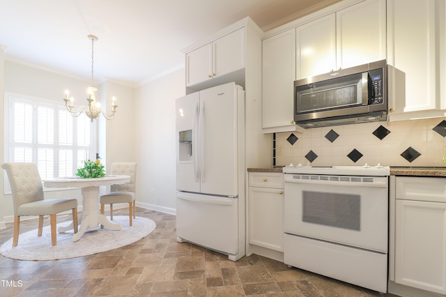 128 Olde Manor Ct, Siler City, NC 27344 - kitchen featuring white appliances, a chandelier, crown molding, decorative backsplash, and stone finish floors