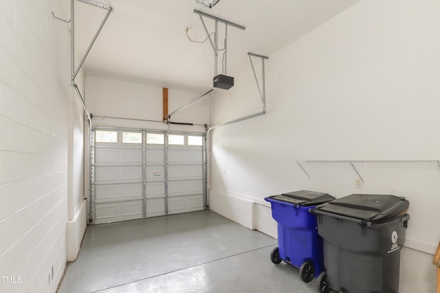 128 Olde Manor Ct, Siler City, NC 27344 - garage featuring a garage door opener and concrete block wall