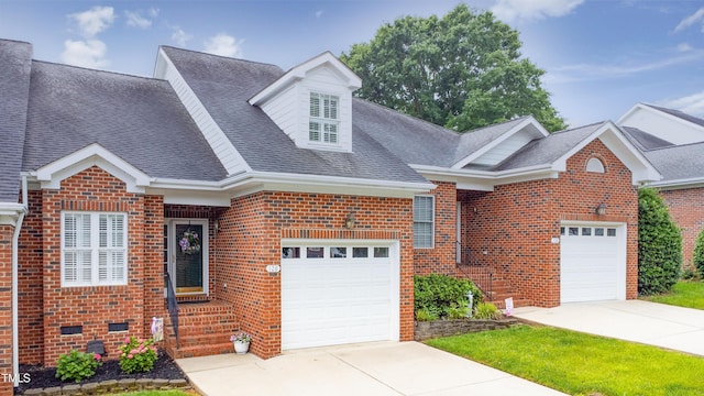 128 Olde Manor Ct, Siler City, NC 27344 - view of front of property with brick siding, driveway, a shingled roof, and an attached garage