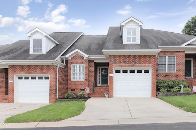 128 Olde Manor Ct, Siler City, NC 27344 - view of front of house featuring driveway, brick siding, a shingled roof, and a garage