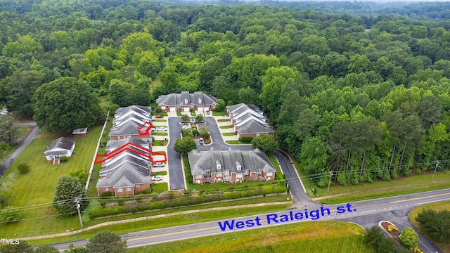 128 Olde Manor Ct, Siler City, NC 27344 - aerial perspective of suburban area featuring a forest