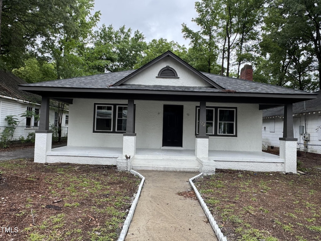 722 Long Ave, Rocky Mount, NC 27801 - bungalow featuring a porch, a shingled roof, and stucco siding