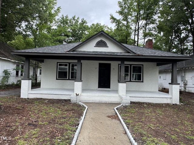 722 Long Ave, Rocky Mount, NC 27801 - bungalow featuring a porch, a shingled roof, and stucco siding