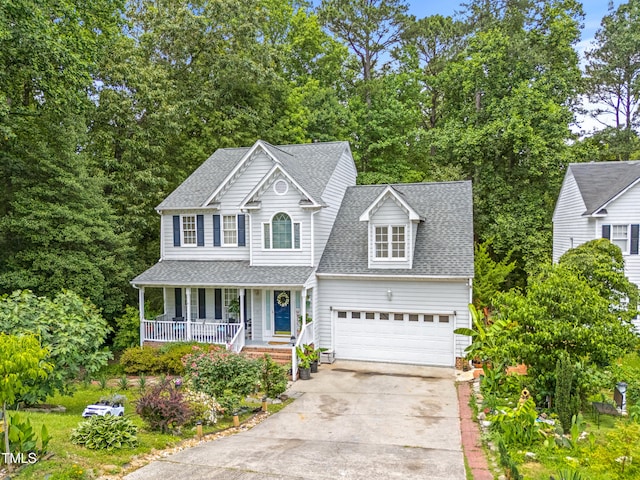 4705 Royal Troon Dr, Raleigh, NC 27604 - traditional-style house with covered porch, driveway, roof with shingles, and an attached garage