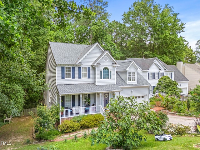 4705 Royal Troon Dr, Raleigh, NC 27604 - traditional-style home featuring covered porch, roof with shingles, a garage, and driveway